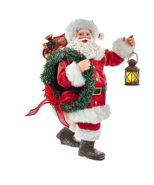 Babbo Natale con Sacco di Doni, Lanterna e Ghirlanda 27 cm